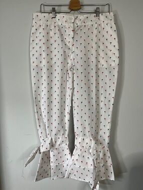 White Cropped Pants with Red & Navy Palm Print w/Ruffled Ties on each leg. 
Sz L